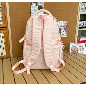 Sac à dos d'école style collège à pois roses pour étudiants et voyages décontractés.