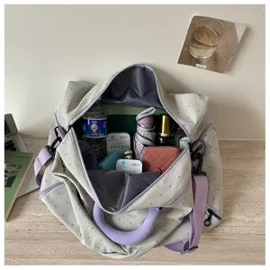 Large capacity travel duffel bag with shoulder strap, perfect for gym, sports and weekend trips.