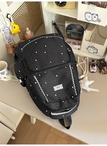 Black star print student backpack with lace trim, large capacity casual school bag.