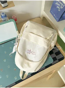 Sac à dos beige doux de style japonais avec broderie d'étoiles mignonnes pour l'école quotidienne.