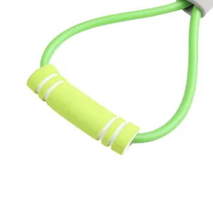 Figure 8 resistance band detail view, green elastic tube with anti-slip foam handle for workout.