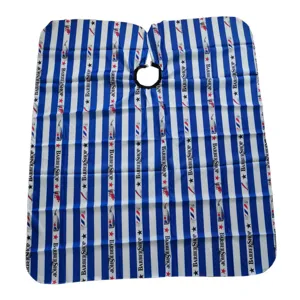 Detailed view of professional salon barber cape with blue and white stripes design for hair cutting.