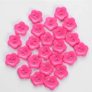 Pink flower shaped buttons for sewing crafts clothes shoes hats hair accessories DIY decor.