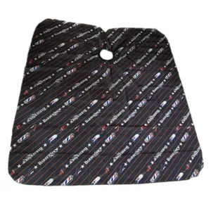 Professional salon barber cape with classic stripes and scissors pattern for haircut styling.