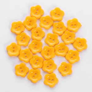Yellow flower resin buttons with two holes, ideal for clothing, shoes, and DIY accessories.