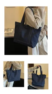 Grand sac cabas en denim pour femme, sac à épaule décontracté avec poche avant.