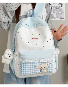 Bonita mochila escolar de estrellas con colgante de perrito tierno y bolsillo de cuadros.