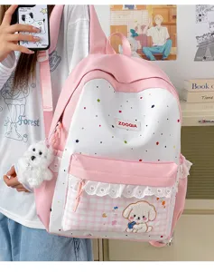 Detalle mochila rosa con estrellas, bolso escolar bonito con parche de cachorro y encaje.