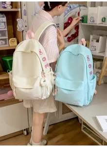 Detail view of minimalist solid color canvas backpack in Korean style for daily use.