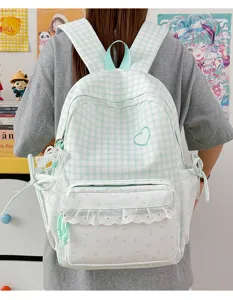 Sweet green plaid school backpack with lace ruffle and heart embroidery for teen girls aesthetic.