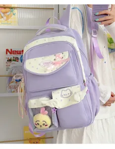Cute purple school backpack with transparent pocket and plush pendant for students.
