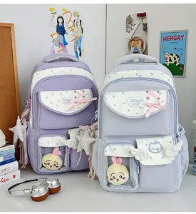 Cute Japanese style ita backpack with transparent front pocket, star patterns and kawaii plush charms.