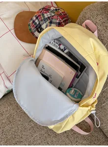 Detailed view of large capacity solid color canvas backpack for school, travel and daily commute.