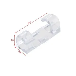 Transparent plastic dual-slot cable clip wire organizer detail view showing compact size.