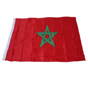 Detail view of Morocco flag, featuring vibrant red color and green star with metal brass grommets.