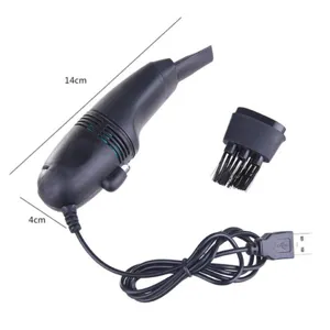 Mini USB keyboard vacuum cleaner with brush attachment for portable desk and laptop cleaning.