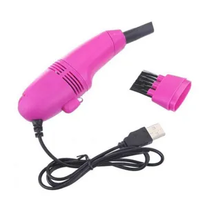 Mini USB vacuum cleaner detail shot, compact pink design with brush attachment for keyboards.