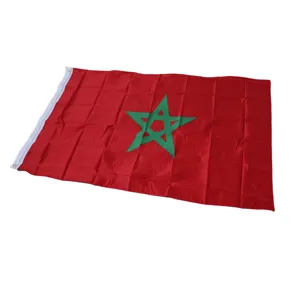 Detail shot of the Morocco flag showing fabric texture, green star, and metal grommets.