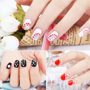 Manicure nail art detail showcase featuring elegant polka dot designs in classic multi colors.