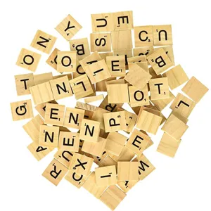 Detailed shot of wooden letter tiles with engraved English alphabets and numbers.