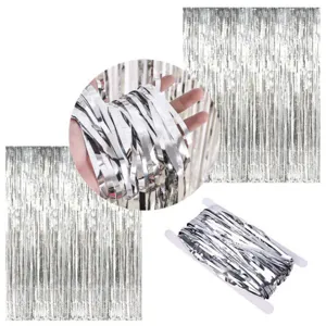 Silver tinsel fringe curtain detail view showing shiny metallic texture and hanging style.