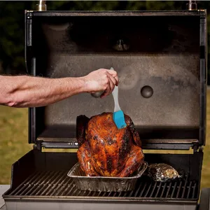 Silicone basting brush with heat-resistant bristles for BBQ, grilling, and baking tasks easily.