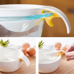 Egg white separator for kitchen baking, silicone clip design fits securely on bowl edges.