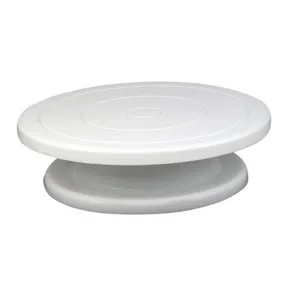 White plastic cake turntable detail shot, smooth rotating design for DIY baking decoration.