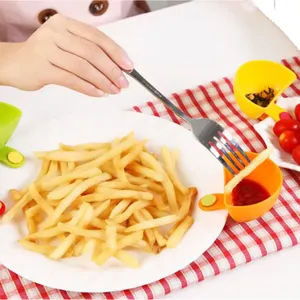Detailed view of creative mini clip-on sauce dish and seasoning bowl for kitchen dining.