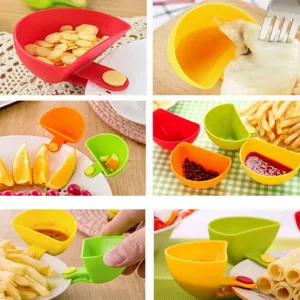 Silicone clip-on dipping bowl for plates, kitchen condiment dish and versatile snack holder.