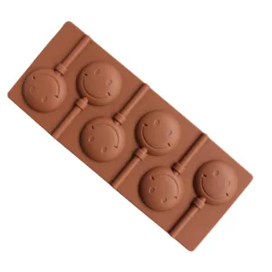 Brown silicone lollipop mold with 6 smiley face cavities for DIY baking chocolate and candy making tools.
