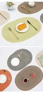 Woven cotton oval placemat detail showcasing neat texture and heat insulation for dining table decor.