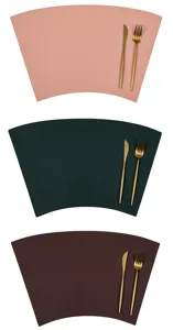 Close-up detail of fan-shaped PU leather placemat with cutlery set for table decor.