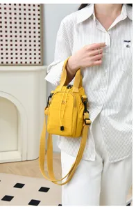 Yellow mini crossbody phone bag, casual nylon bucket bag with drawstring and top handle for women.