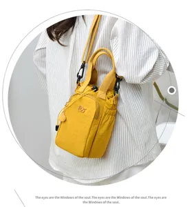Casual small crossbody phone bag for women, cute yellow drawstring bucket shoulder bag.