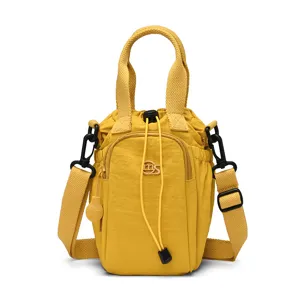 Yellow nylon mini bucket bag for women, casual crossbody phone bag with drawstring.