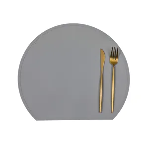 Modern grey silicone placemat featuring elegant gold cutlery for stylish dining table decor.