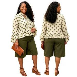 Plus size women's stylish polka dot long sleeve blouse and green shorts outfit set.