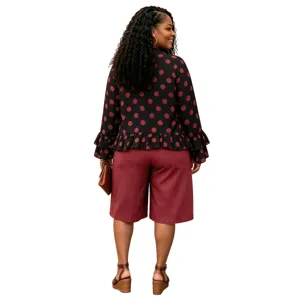 Plus size polka dot long sleeve ruffle top and matching shorts casual outfit for women.