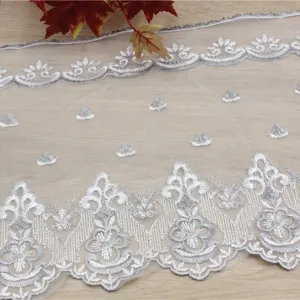 Silver embroidered water-soluble lace trim for DIY sewing, curtains, and tablecloths.