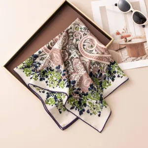 Close-up detail of the silk wool square scarf featuring classic paisley and floral print pattern.
