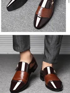 Men's business dress shoes detail showing contrast color leather upper and side zipper.