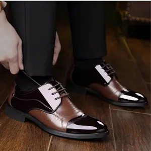 Men's British style business formal leather shoes detail shot showing patchwork brown design.
