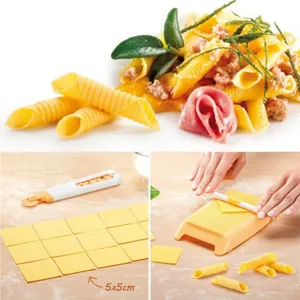 Detail view of Italian pasta maker set, showing homemade spiral macaroni and dough cutting tool.