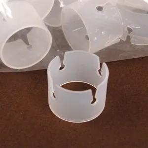 Close-up detail of translucent plastic balloon arch ring clip for party decoration setup.
