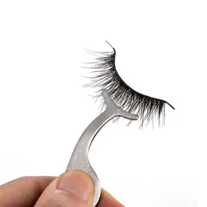 Eyelash applicator tool with false lashes detail shot, stainless steel Y-clip design for easy makeup.