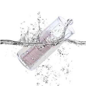 Detailansicht der klaren Acryl Wattepad Aufbewahrungsbox mit coolem Wasserspritzer Effekt.