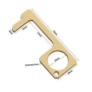 Detail view of brass EDC door opener showing precise dimensions, thickness and key ring hole.