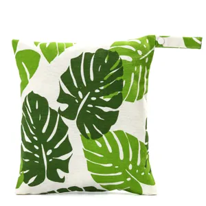 Portable baby diaper wet bag with green monstera leaf print detail for outdoor travel storage.