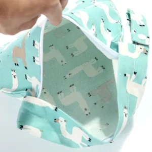 Portable baby diaper hanging bag with cute llama print, ideal for crib storage organization.
